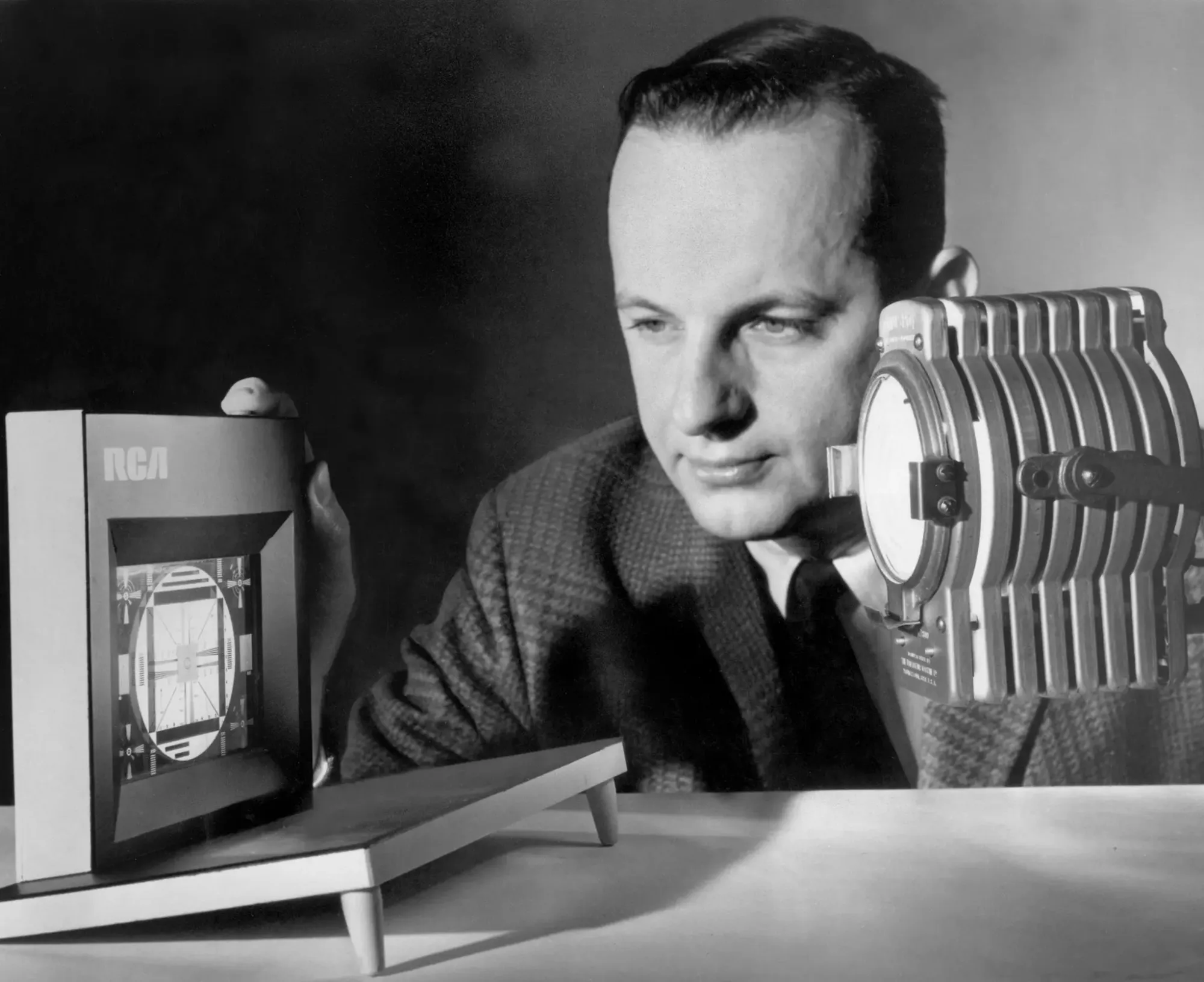 George Heilmeier demonstrating an early prototype of a liquid crystal display.