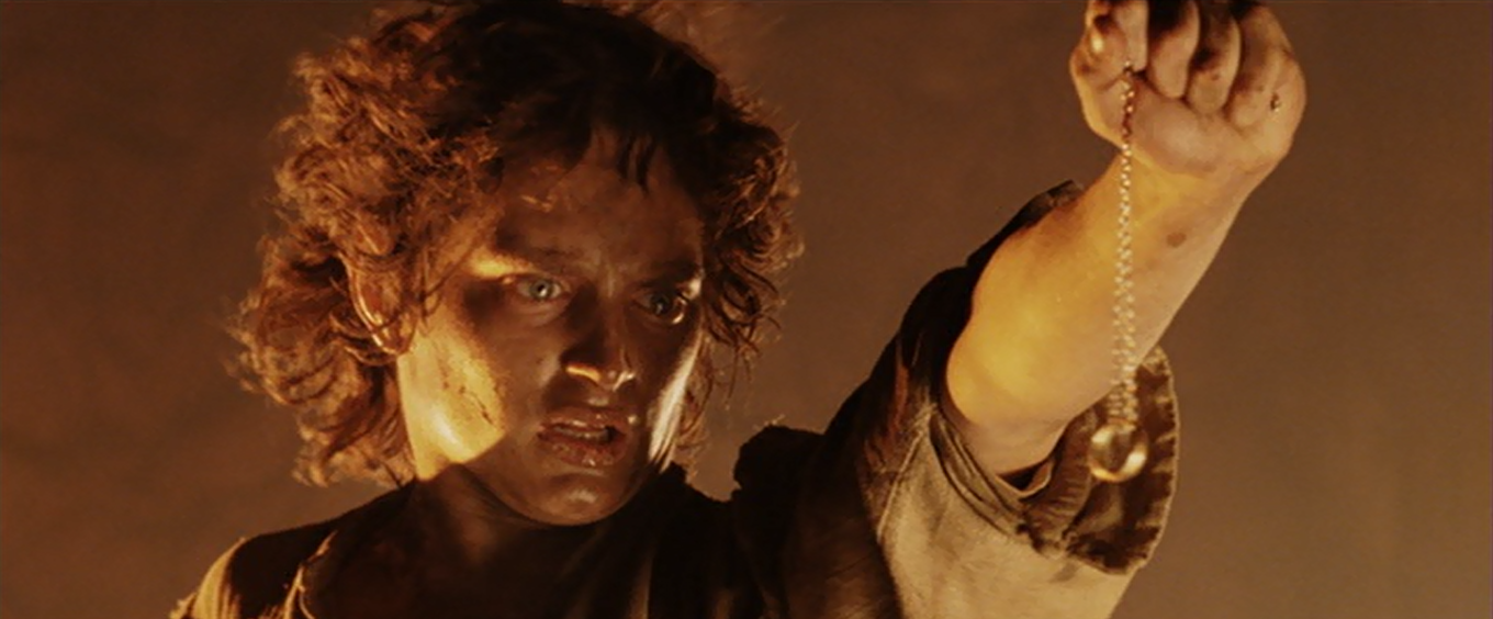 Frodo about to drop the One Ring into Mount Doom’s molten heart.