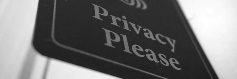 Picture of a sign that says "Privacy Please".
