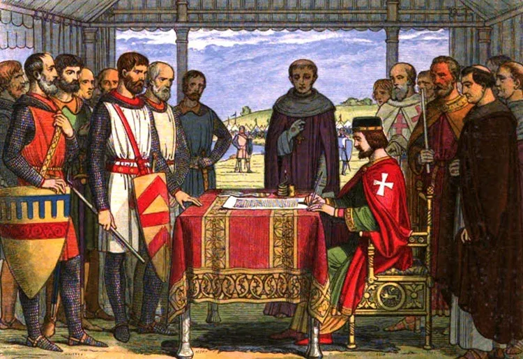 King John seated at a table, signing the Magna Carta document, as nobles and clergy look on.